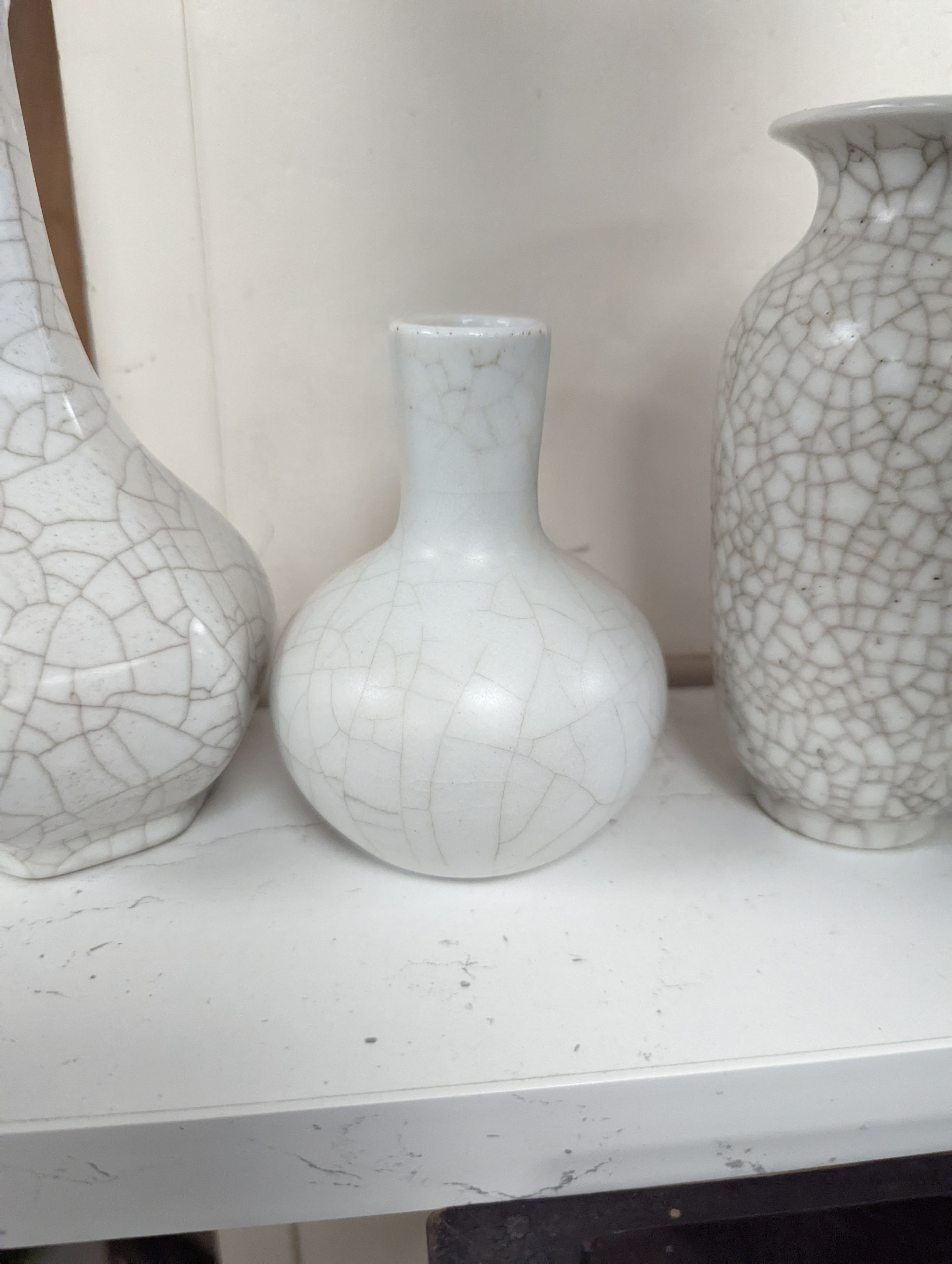 Four Chinese crackle glaze vases, tallest 16 cms high.